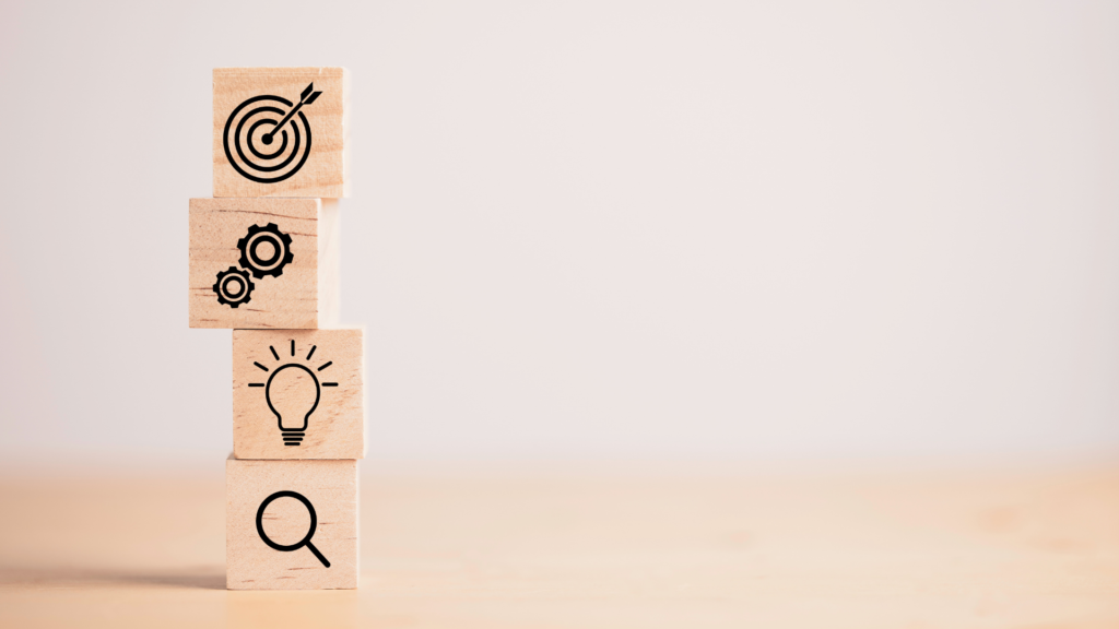 A stack of wooden blocks with icons on them